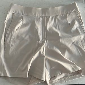 Nike. Women’s golf shorts. Size X-Small. Khaki. Drawstring.